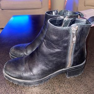 Euro trendy black leather booties with double zippers and lug sole. Size 7